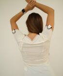 White T-shirt with black print and rhinestones