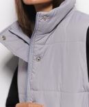 Quilted gray women's vest with waist ties.