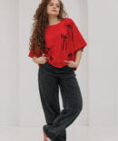 Red oversized women's t-shirt with black bows.