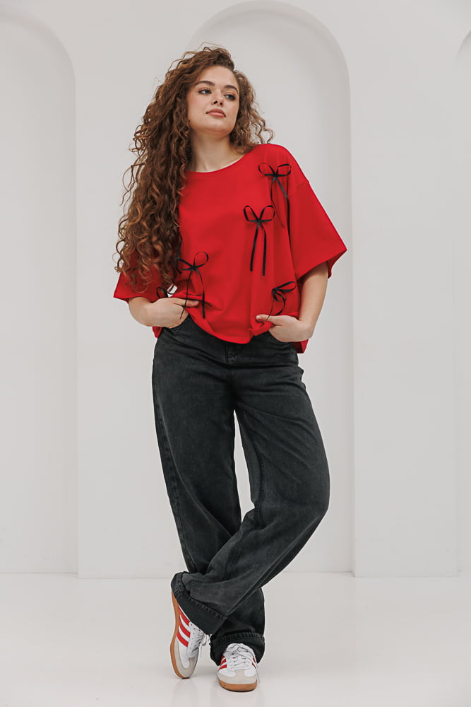 Red oversized women's t-shirt with black bows.