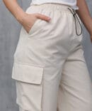 Women's cargo pants light beige with drawstrings at the bottom