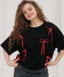 Black oversized women's t-shirt with red bows.