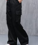 Women's black cargo pants with drawstrings at the bottom