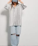 Women's white pleated shirt with short sleeves.