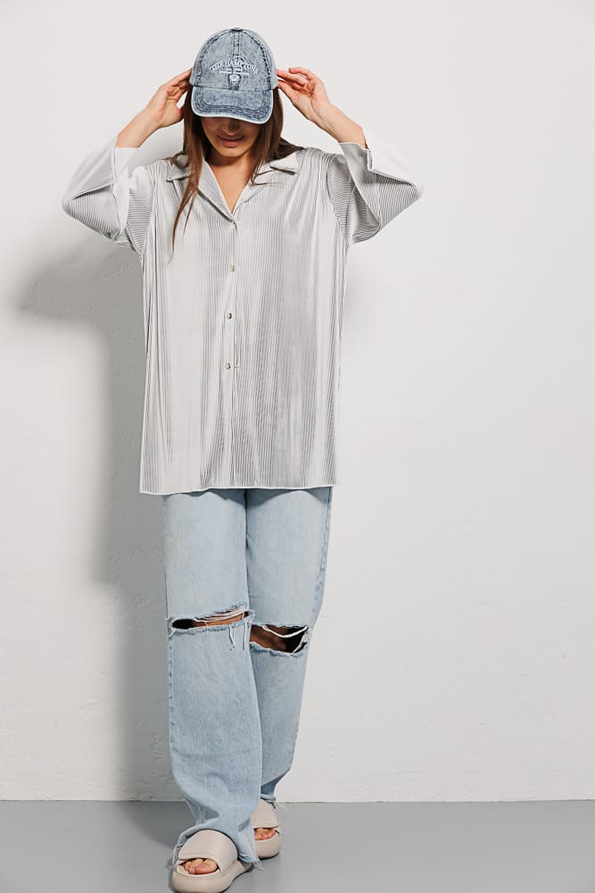 Women's white pleated shirt with short sleeves.