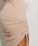 Short light beige knitted dress with side drawstrings