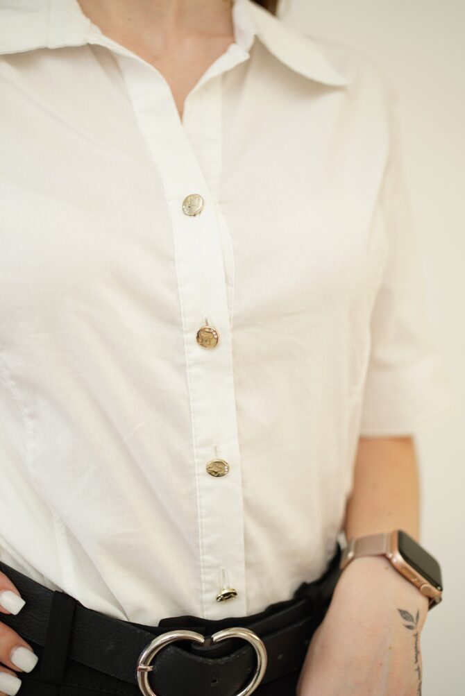 White shirt on the back of rhinestones and embroidered hole