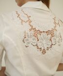 White shirt on the back of rhinestones and embroidered hole