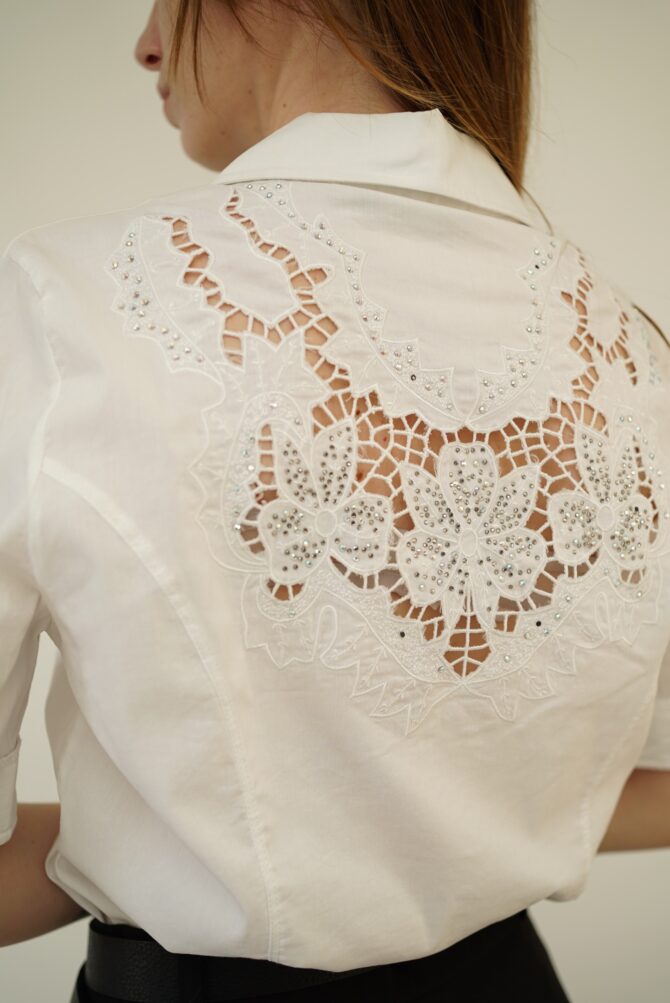 White shirt on the back of rhinestones and embroidered hole