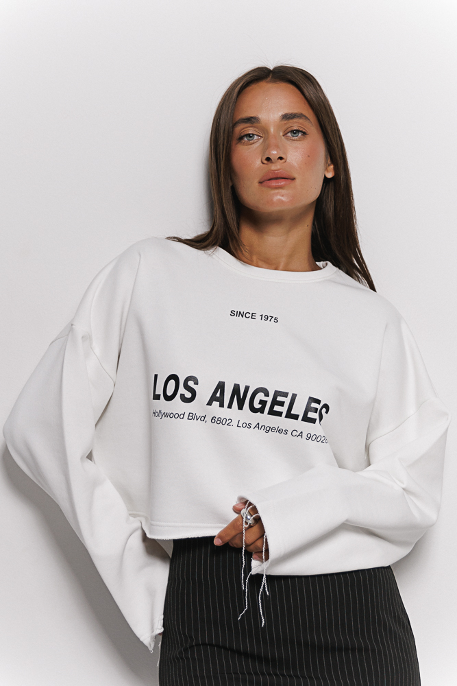 Women's cropped sweatshirt with a Los Angeles print in cream.