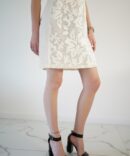 White lace dress with gold clasp on the front