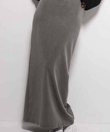 Long dark gray pinstripe pencil skirt made from suiting fabric.