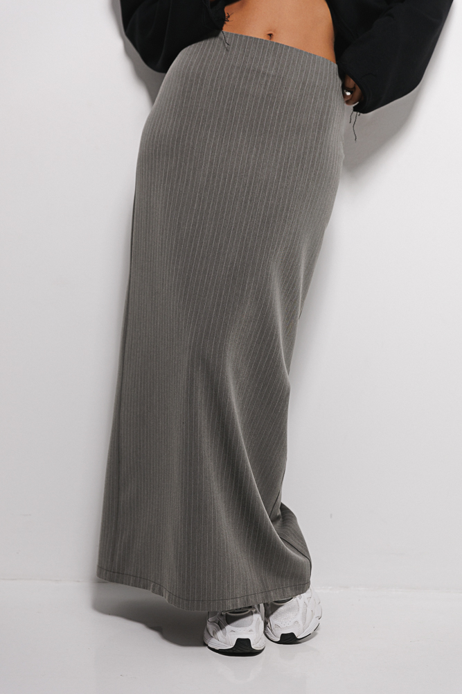 Long dark gray pinstripe pencil skirt made from suiting fabric.