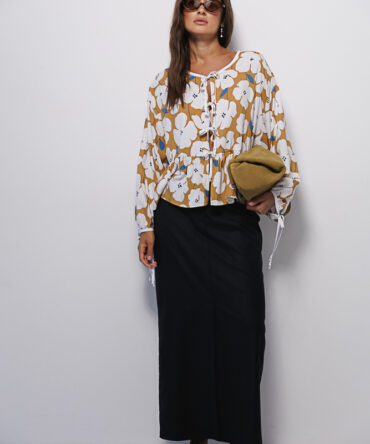 Loose mustard blouse with cream flowers and bow ties.