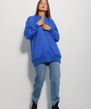 Elongated women's electric windbreaker with a pocket on the sleeve