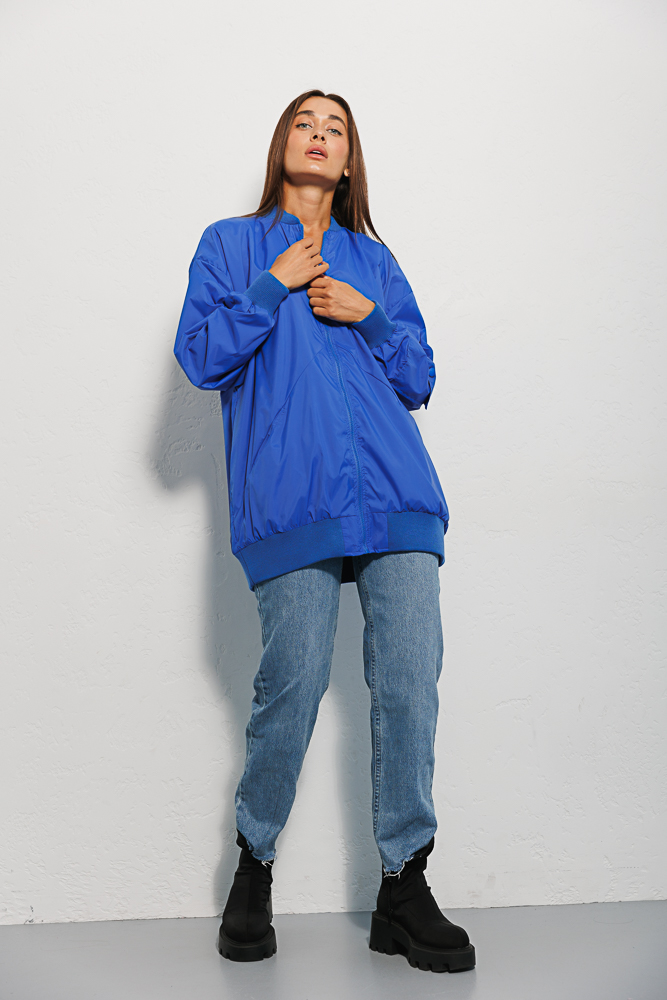 Elongated women's electric windbreaker with a pocket on the sleeve