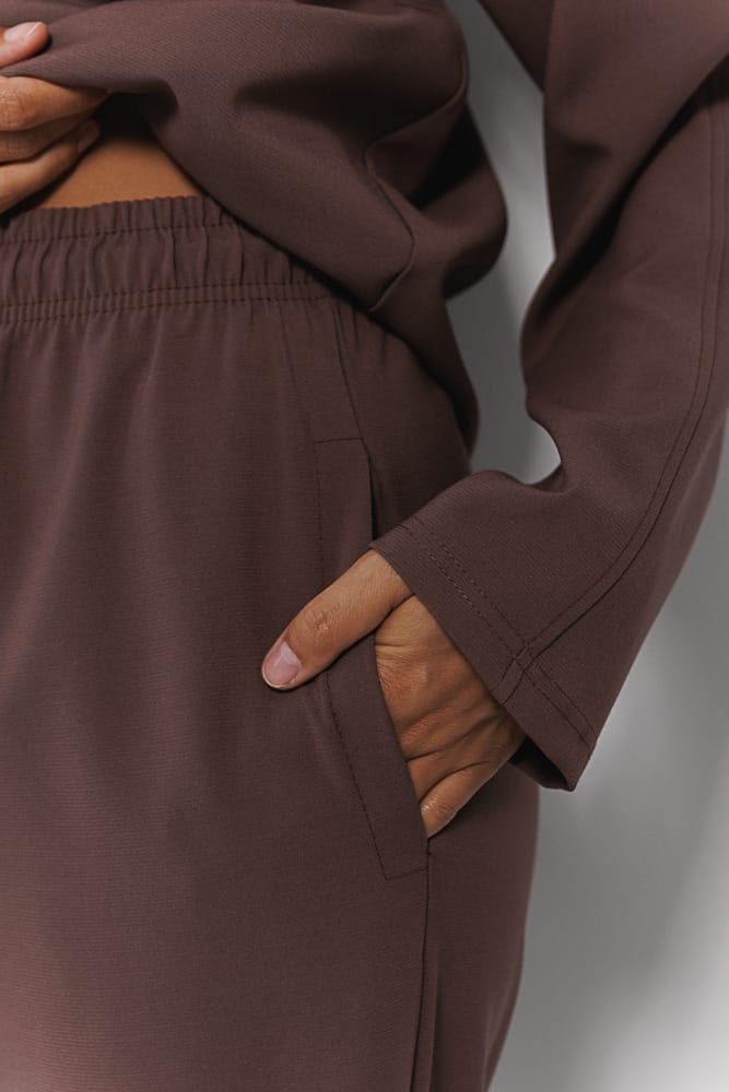 Women's suit with brown pants and sweater