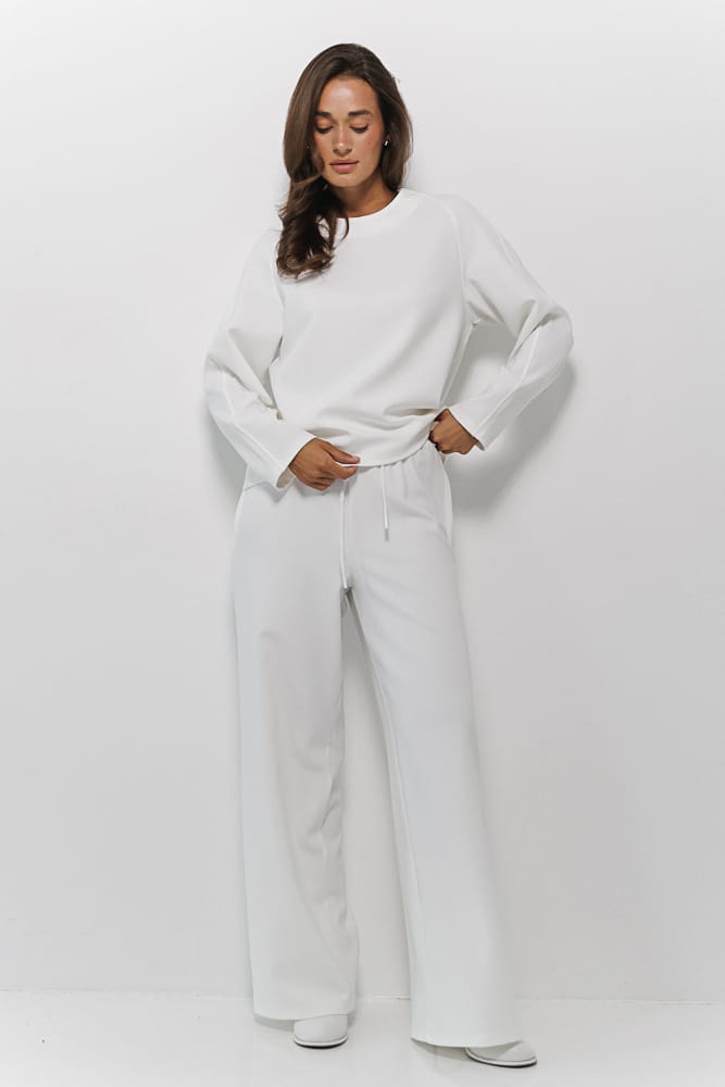 Women's suit with pants and sweater in milky color