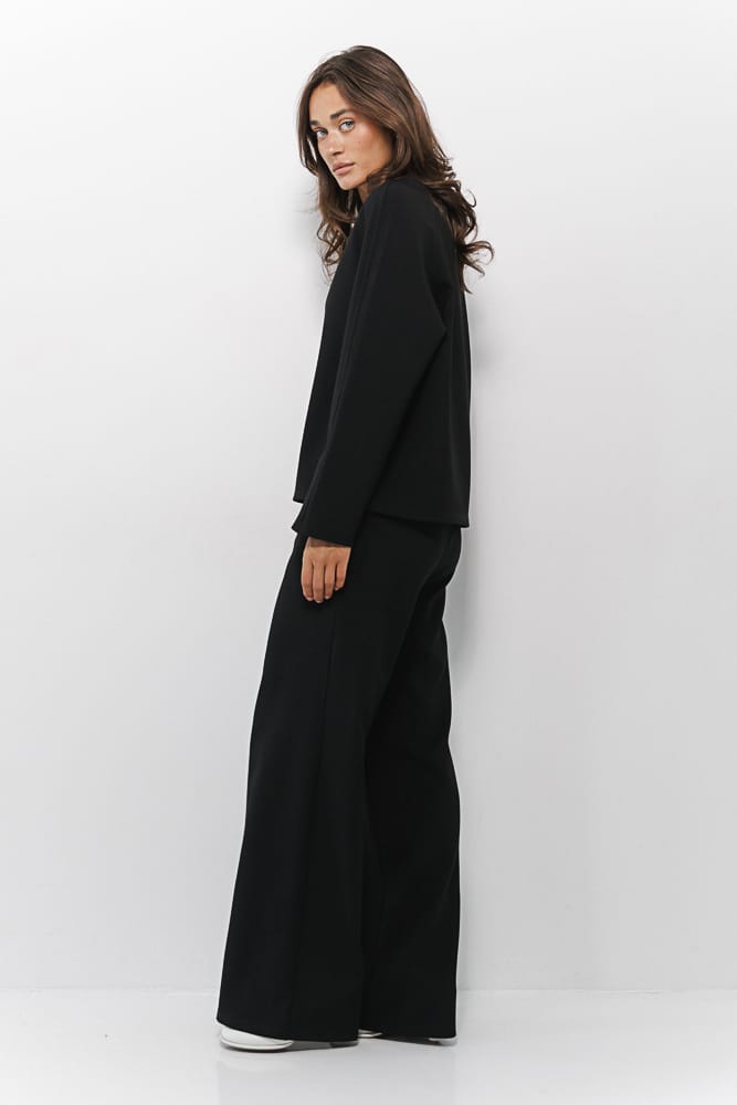 Women's suit with black trousers and sweater