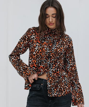 Women's milk-colored shirt with a leopard print.