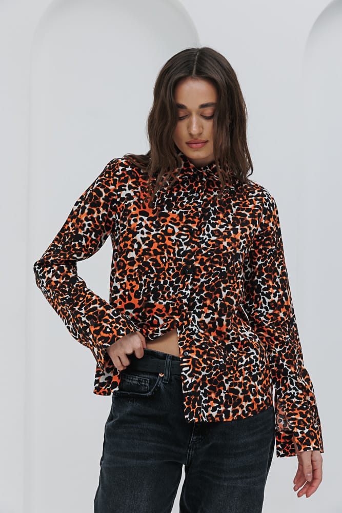 Women's milk-colored shirt with a leopard print.