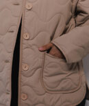 Women's beige quilted jacket for the mid-season.