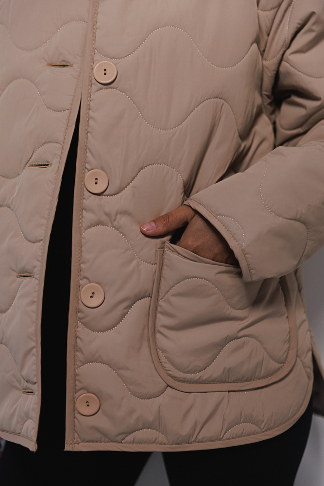 Women's beige quilted jacket for the mid-season.