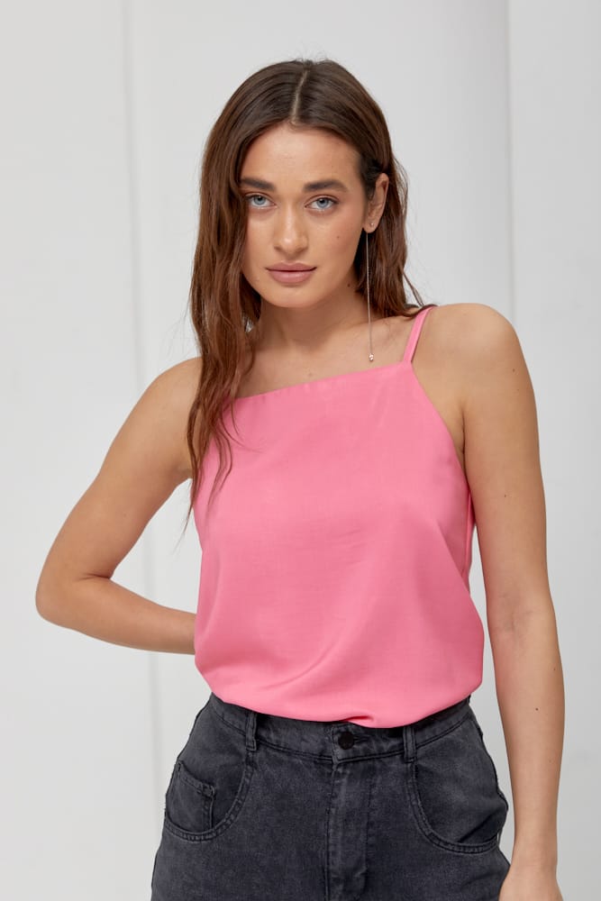 Pink silk women's top with a straight neckline.