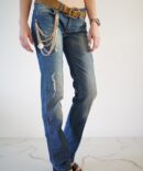 Jeans with scuffs and chains on the pockets