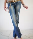 Jeans with scuffs and chains on the pockets