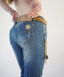 Jeans with scuffs and chains on the pockets