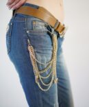 Jeans with scuffs and chains on the pockets