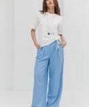 Women's blue linen palazzo pants with pleats.