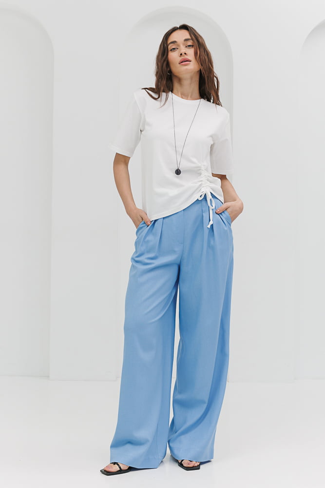 Women's blue linen palazzo pants with pleats.