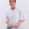 Жіноча футболка oversize молочна з вишитим написом Nude