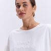 Жіноча футболка oversize молочна з вишитим написом Nude