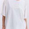 Жіноча футболка oversize молочна з вишитим написом Nude