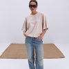 Жіноча футболка oversize світло-бежева з вишитим написом Nude