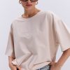 Жіноча футболка oversize світло-бежева з вишитим написом Nude