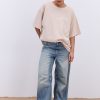 Жіноча футболка oversize світло-бежева з вишитим написом Nude