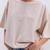 Жіноча футболка oversize світло-бежева з вишитим написом Nude