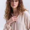 Блуза oversize бежева з рюшами внизу рукавів
