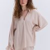 Блуза oversize бежева з рюшами внизу рукавів