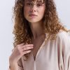 Блуза oversize бежева з рюшами внизу рукавів