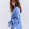 Блуза oversize блакитна з рюшами внизу рукавів