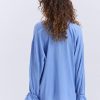 Блуза oversize блакитна з рюшами внизу рукавів