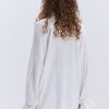 Блуза oversize молочна з рюшами внизу рукавів