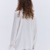 Блуза oversize молочна з рюшами внизу рукавів