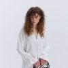 Блуза oversize молочна з рюшами внизу рукавів