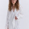 Блуза oversize молочна з рюшами внизу рукавів